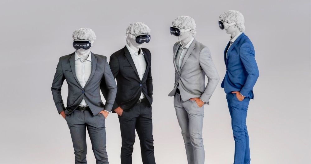 Four statues of businessmen wearing Vision Pro headsets. The statues are dressed in suits and positioned in different stances against a neutral background