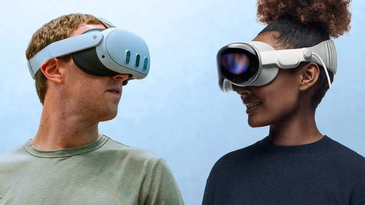 A lady and a man wearing apple vision pro headsets facing each other